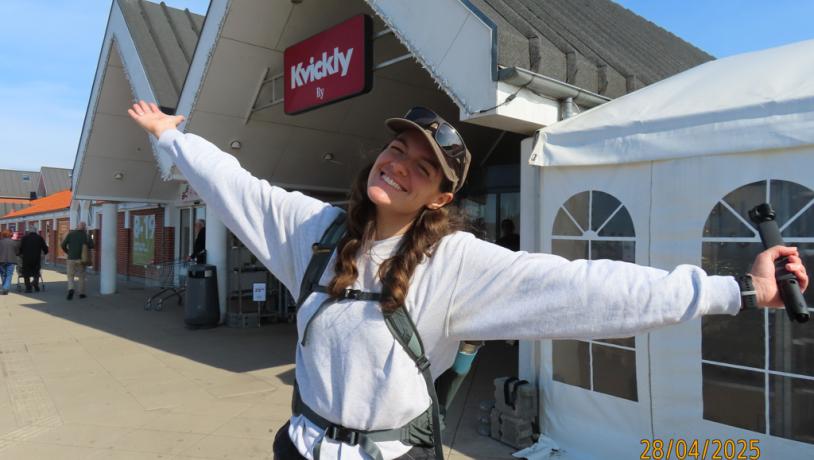 A girl standing outside a local supermarket in Ry, a small town near Skanderborg.